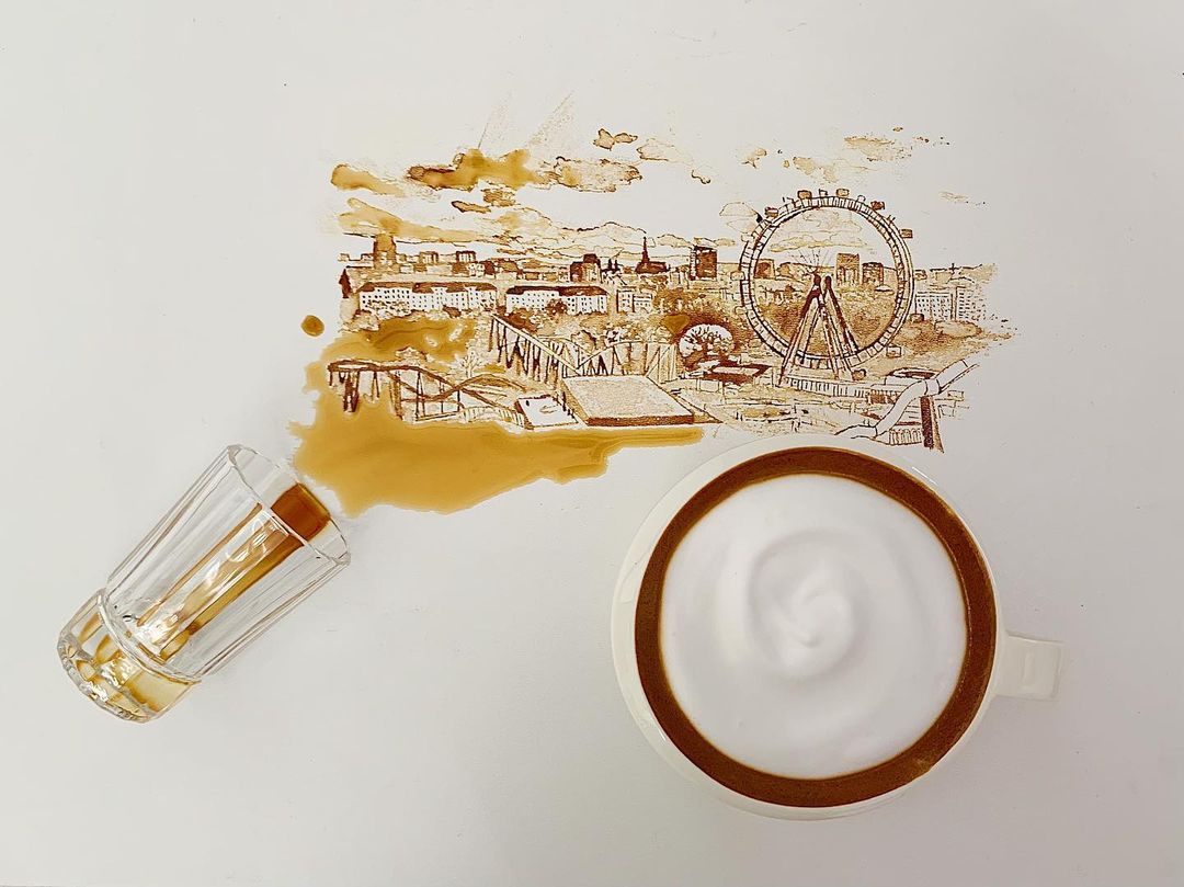 A spilled coffee cleverly turned into a whimsical cityscape painting