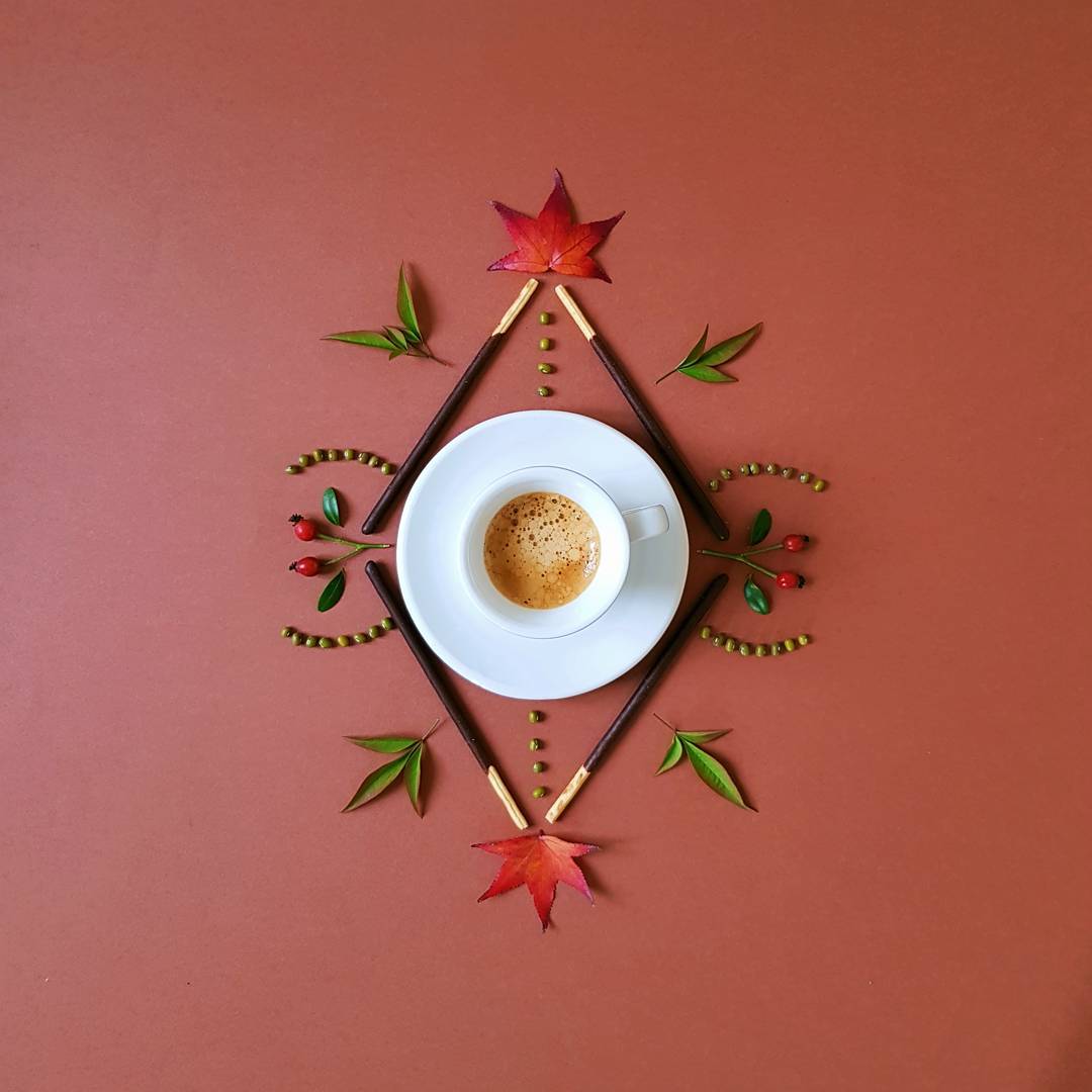 A meticulously arranged coffee table with autumnal elements