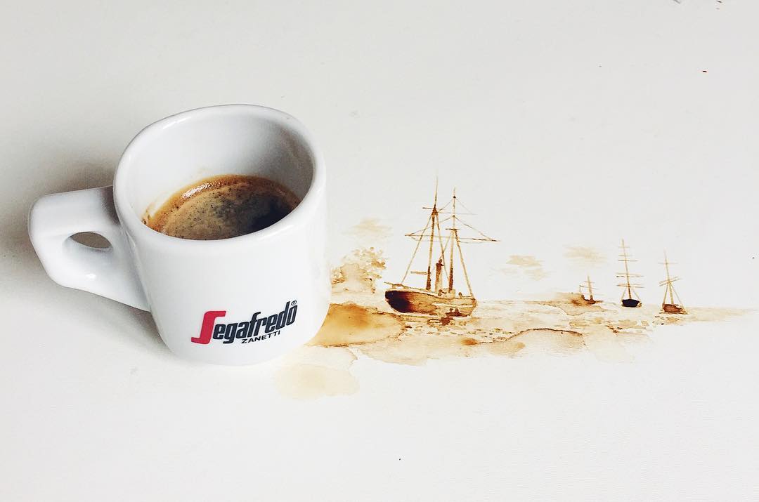 Artistic spillage creating a scene of sailing ships on coffee-stained paper