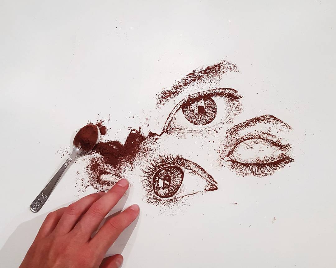 Creative depiction of eyes and nose created with coffee grounds