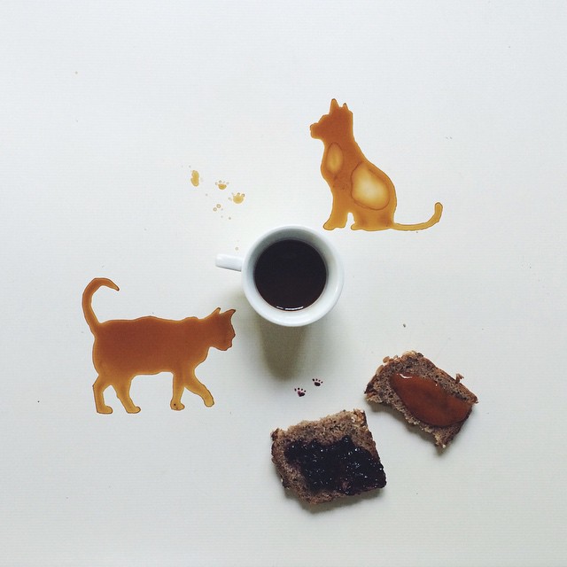 Creative breakfast scene with cat silhouettes in spilled coffee