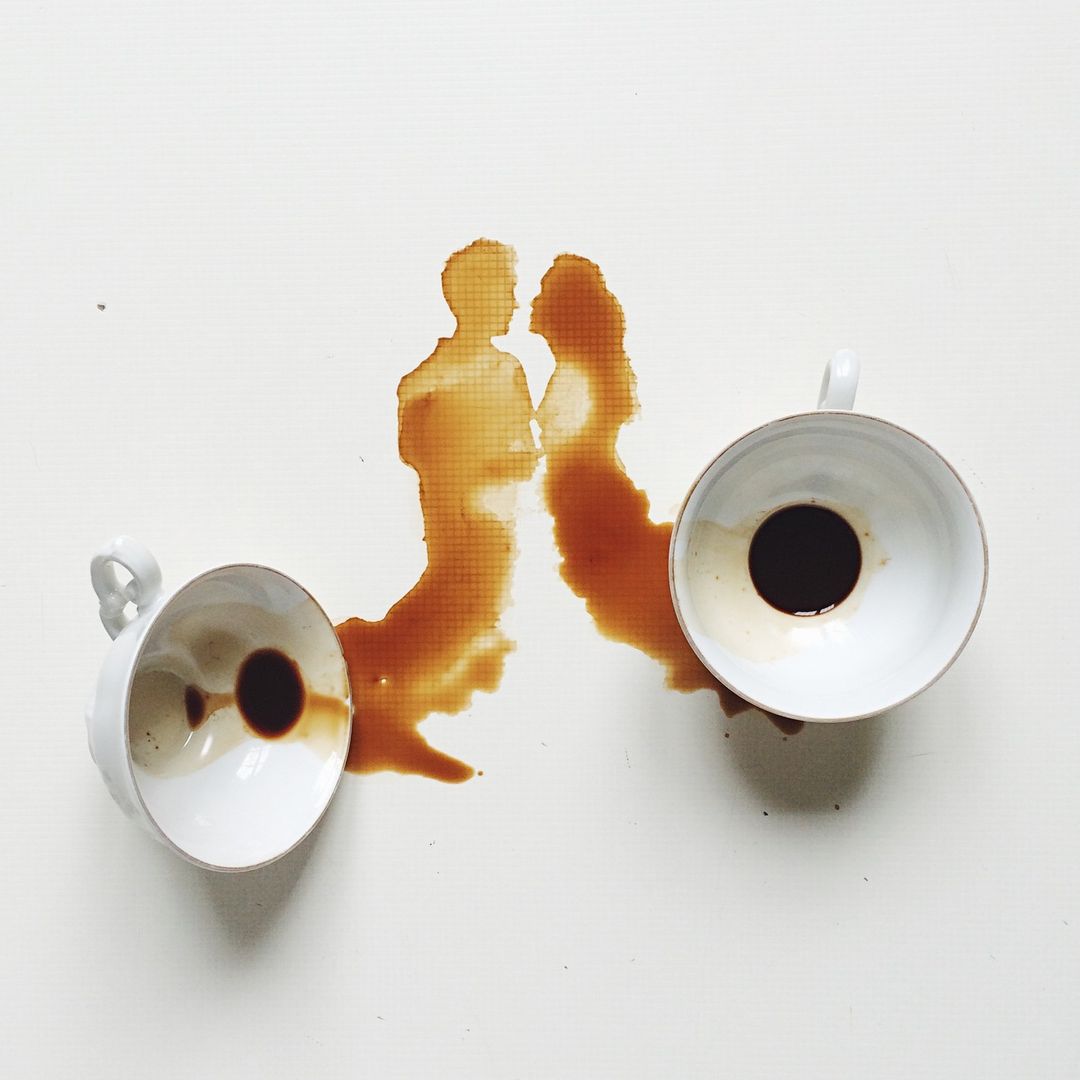 Artistic representation of two people using coffee spills