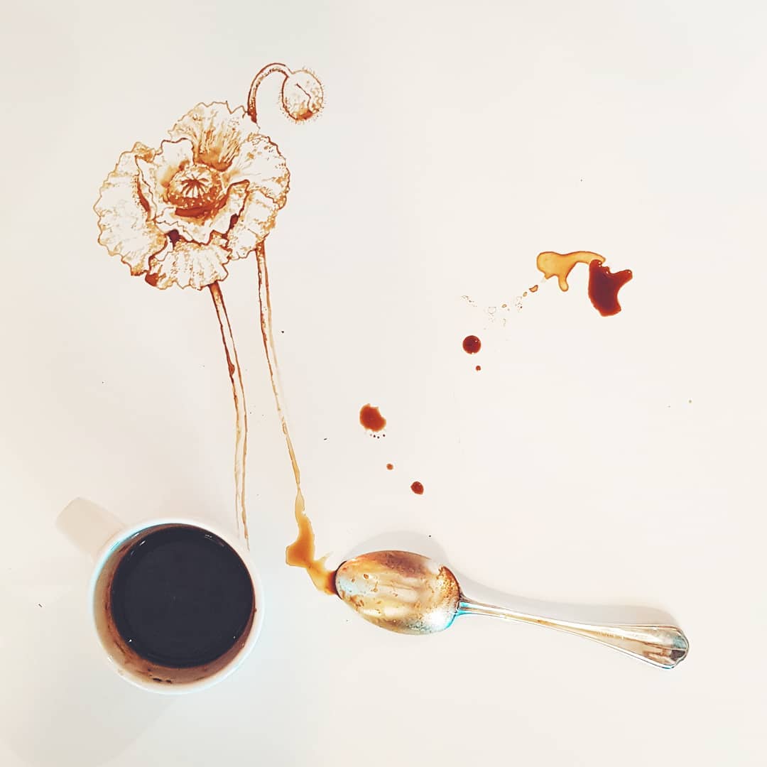 A skillfully crafted artwork using coffee spills to form a delicate flower