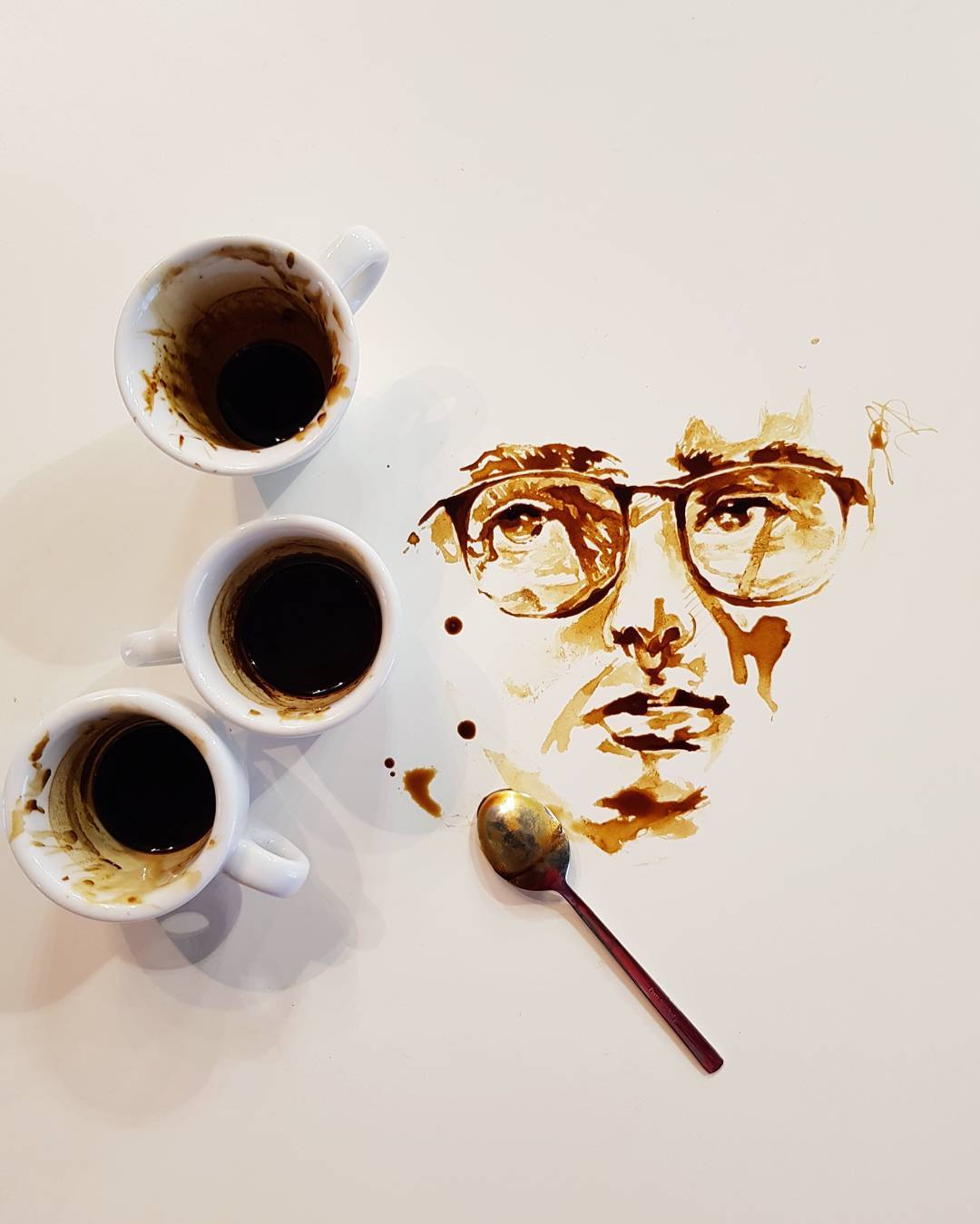 An artistic portrayal of a person created with coffee spills and drips