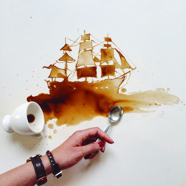 Artistic coffee spill creating the illusion of a sailing ship