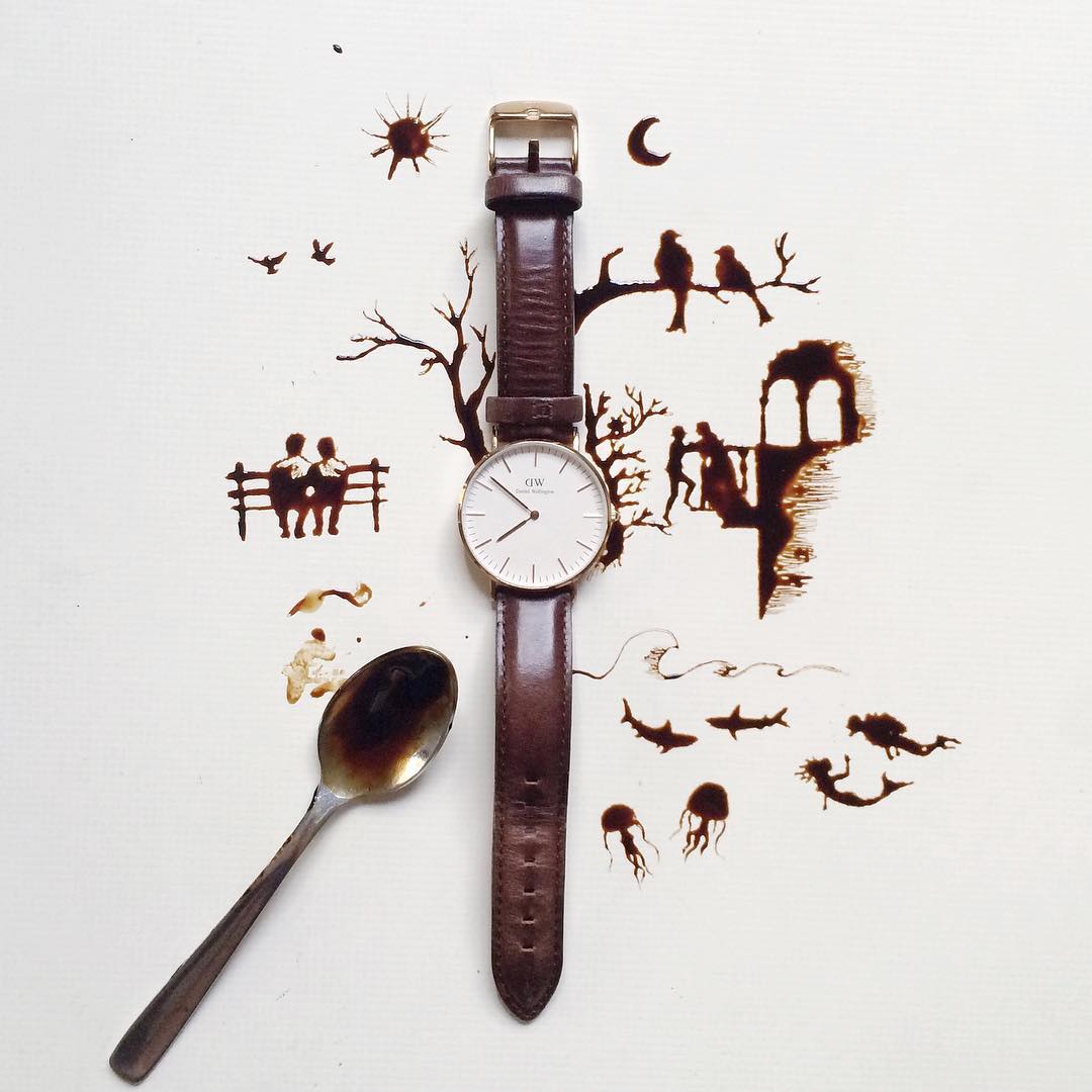 A whimsical composition using a watch and a spoon to depict various scenes of life, like people on a bench and birds on a tree, crafted with splattered coffee stains.