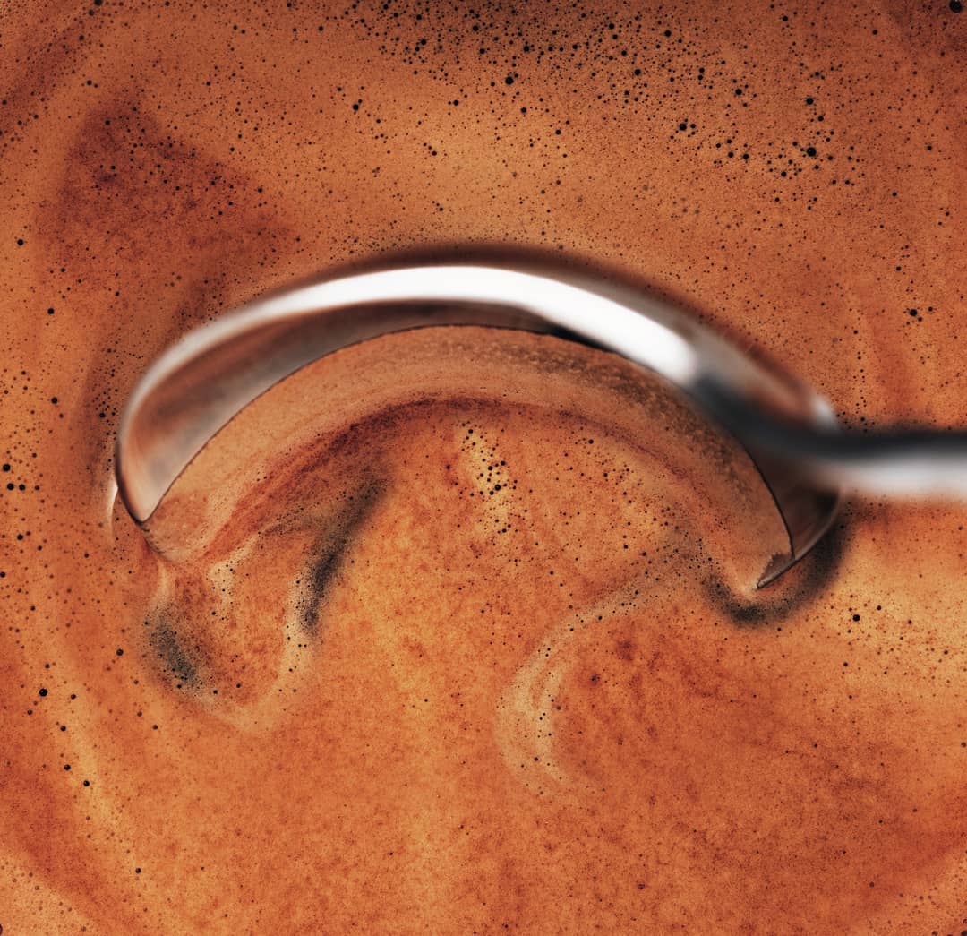 Close-up of an espresso shot with a crema layer