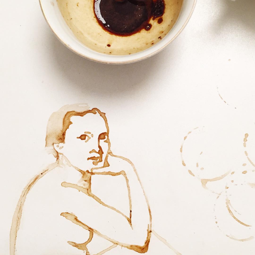 An artistic depiction of a human figure made with coffee stains