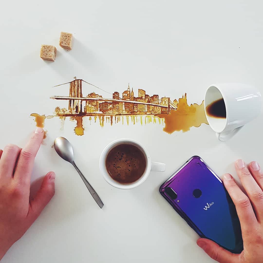 A cleverly crafted coffee spill transformed into a cityscape silhouette