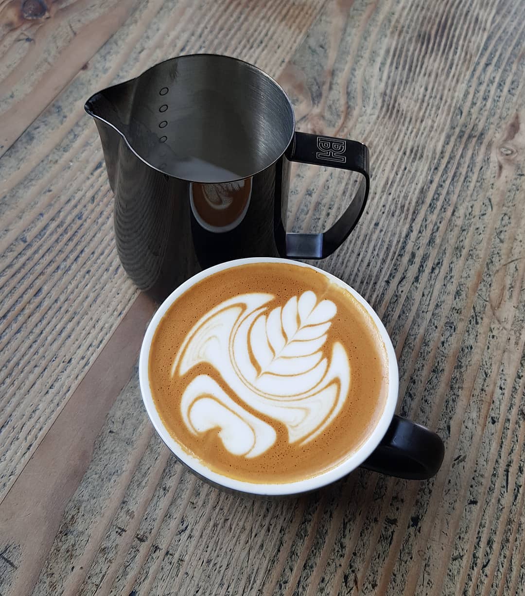 Beautifully crafted latte with intricate latte art