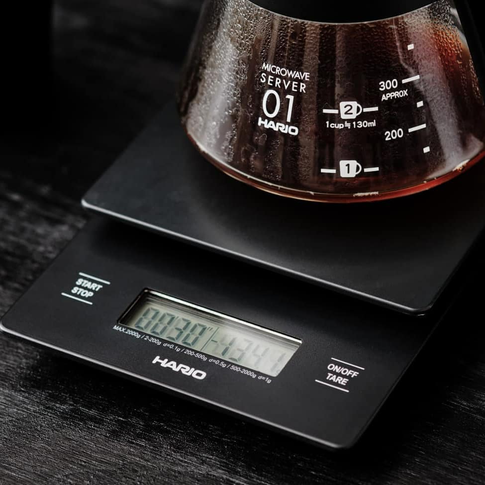 HARIO V60 coffee scale with a glass server on top