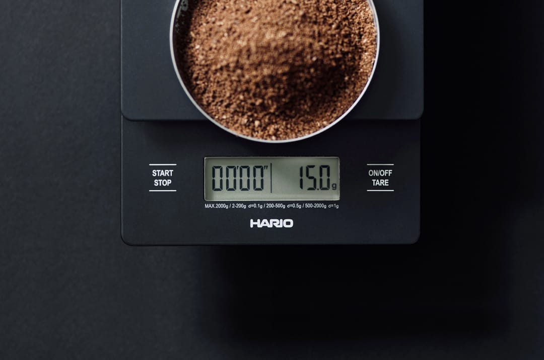 Precision coffee ground scale showing 15.0 grams